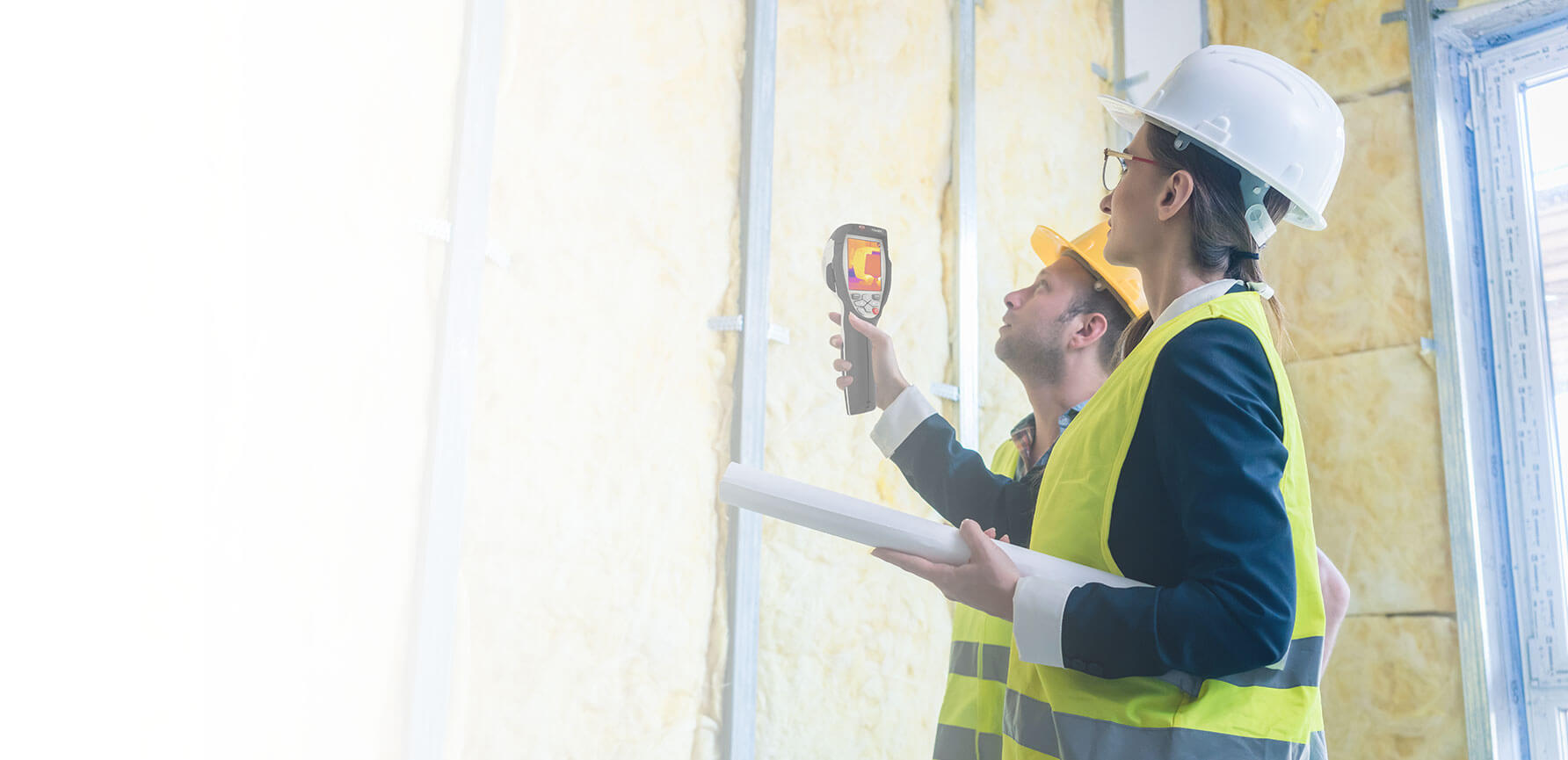 construction workers using handheld infrared camera